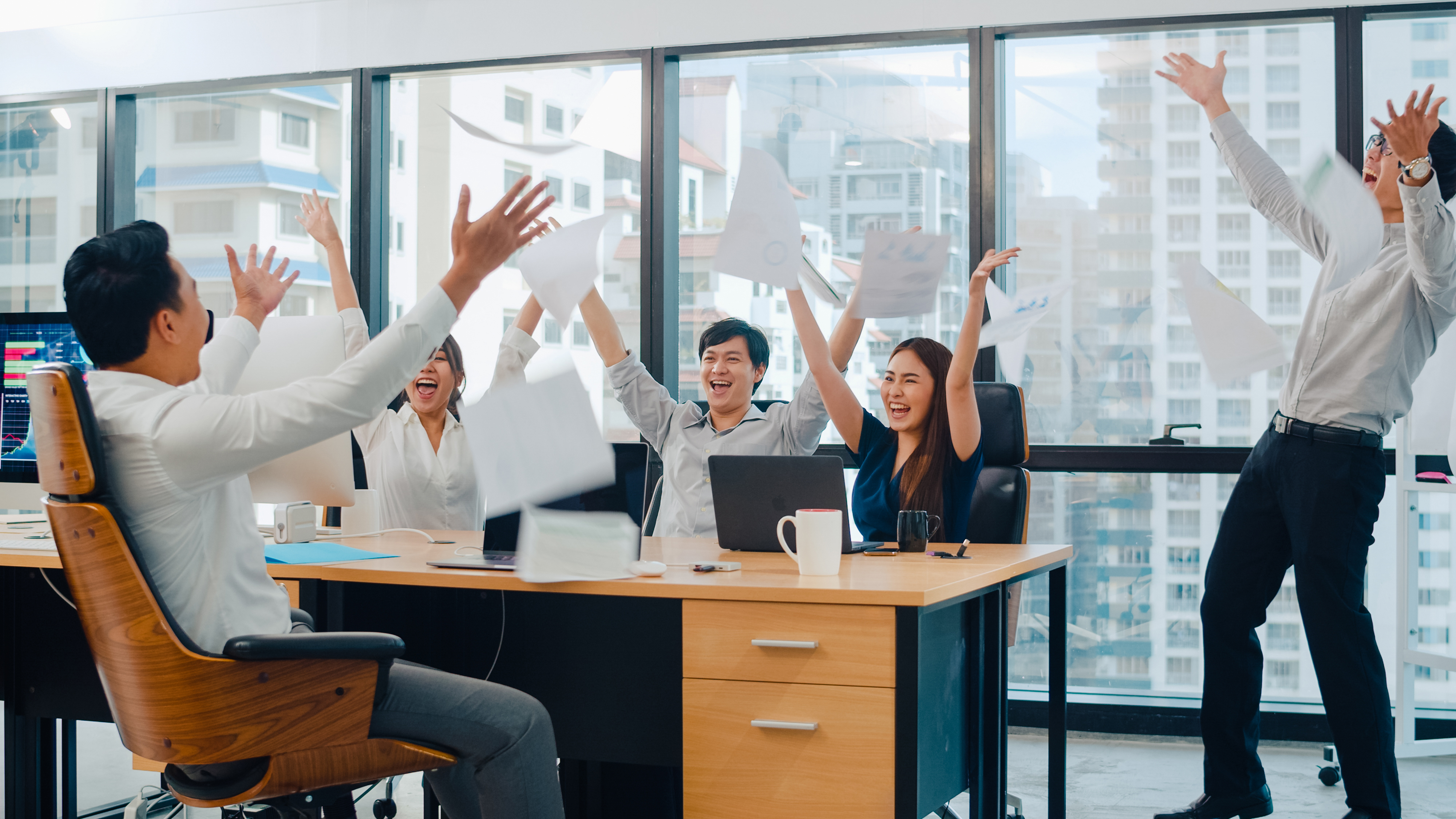 millennial-group-young-businesspeople-asia-businessman-businesswoman-throwing-documents-feeling-happy-achievements-after-succeed-result-meeting-room-small-modern-office-urban-city